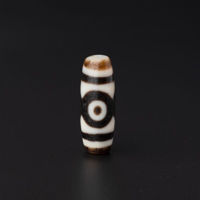 Brown-and-White Bead with a Single Eye