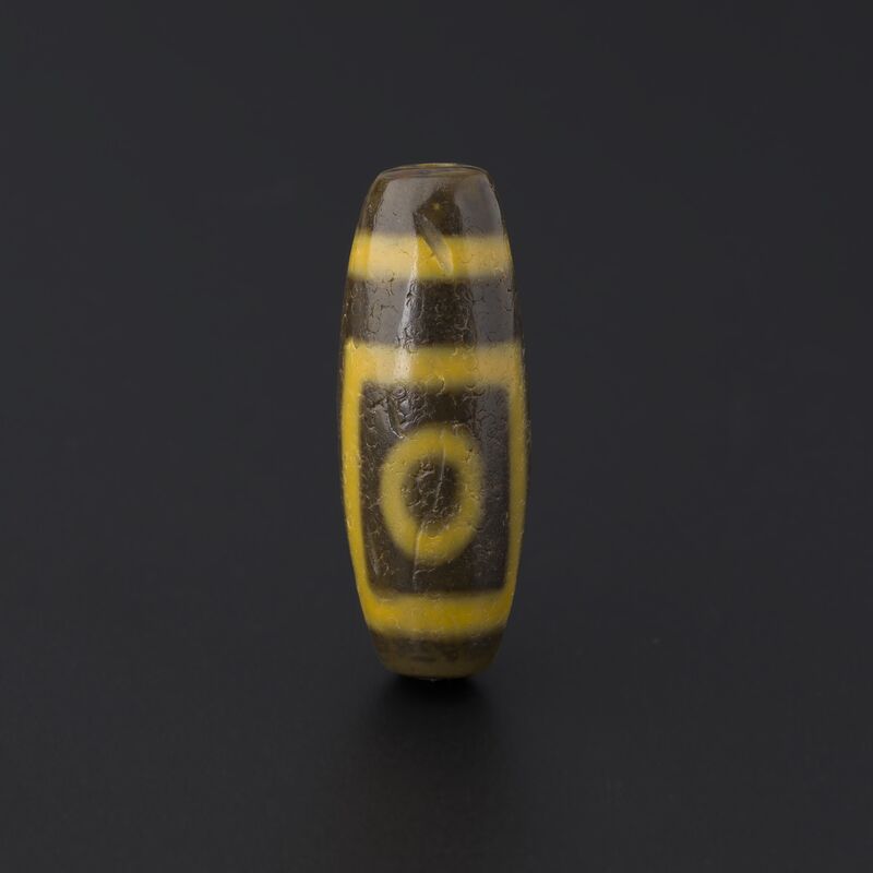 Yellow-and-Black Bead with a Single Eye