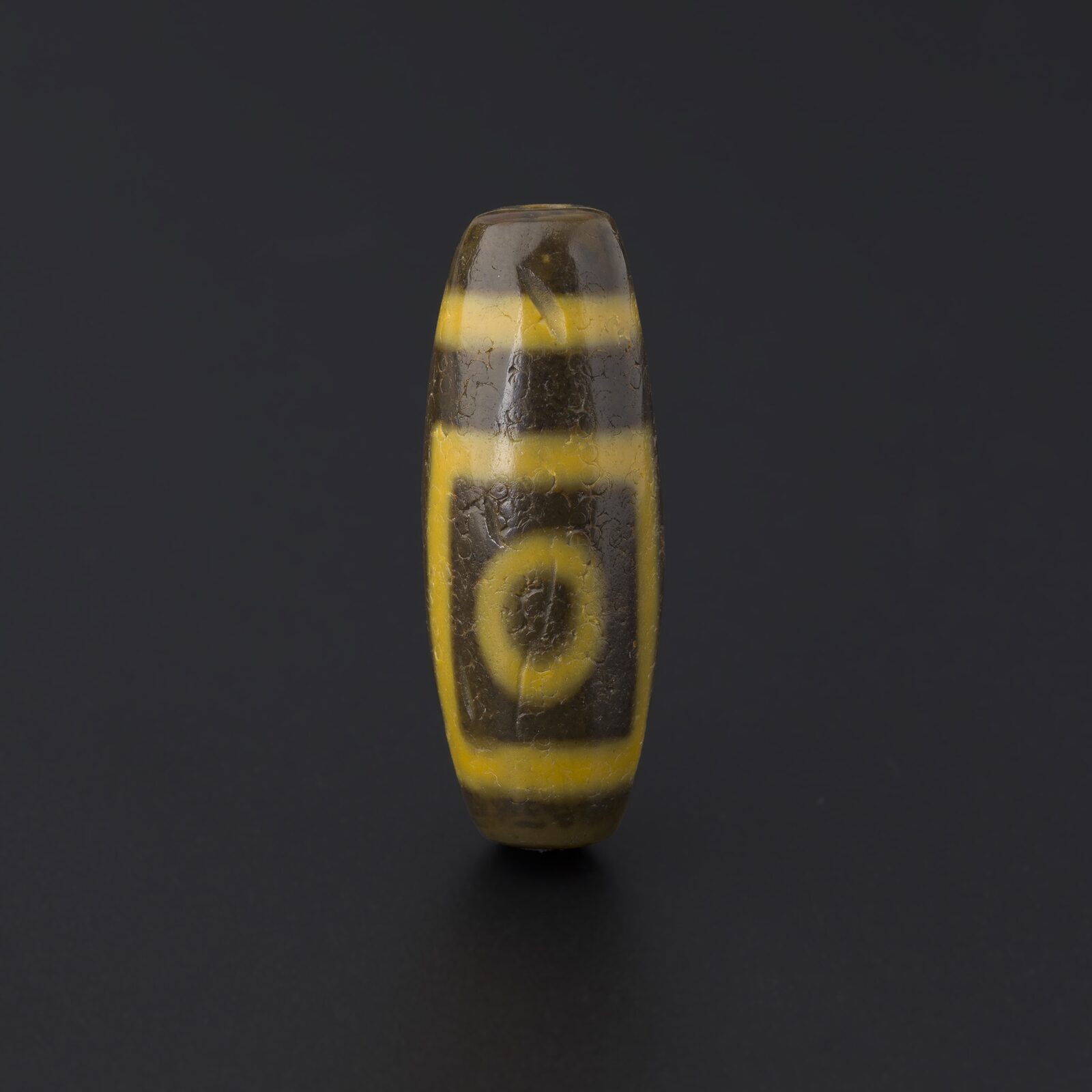 Yellow-and-Black Bead with a Single Eye